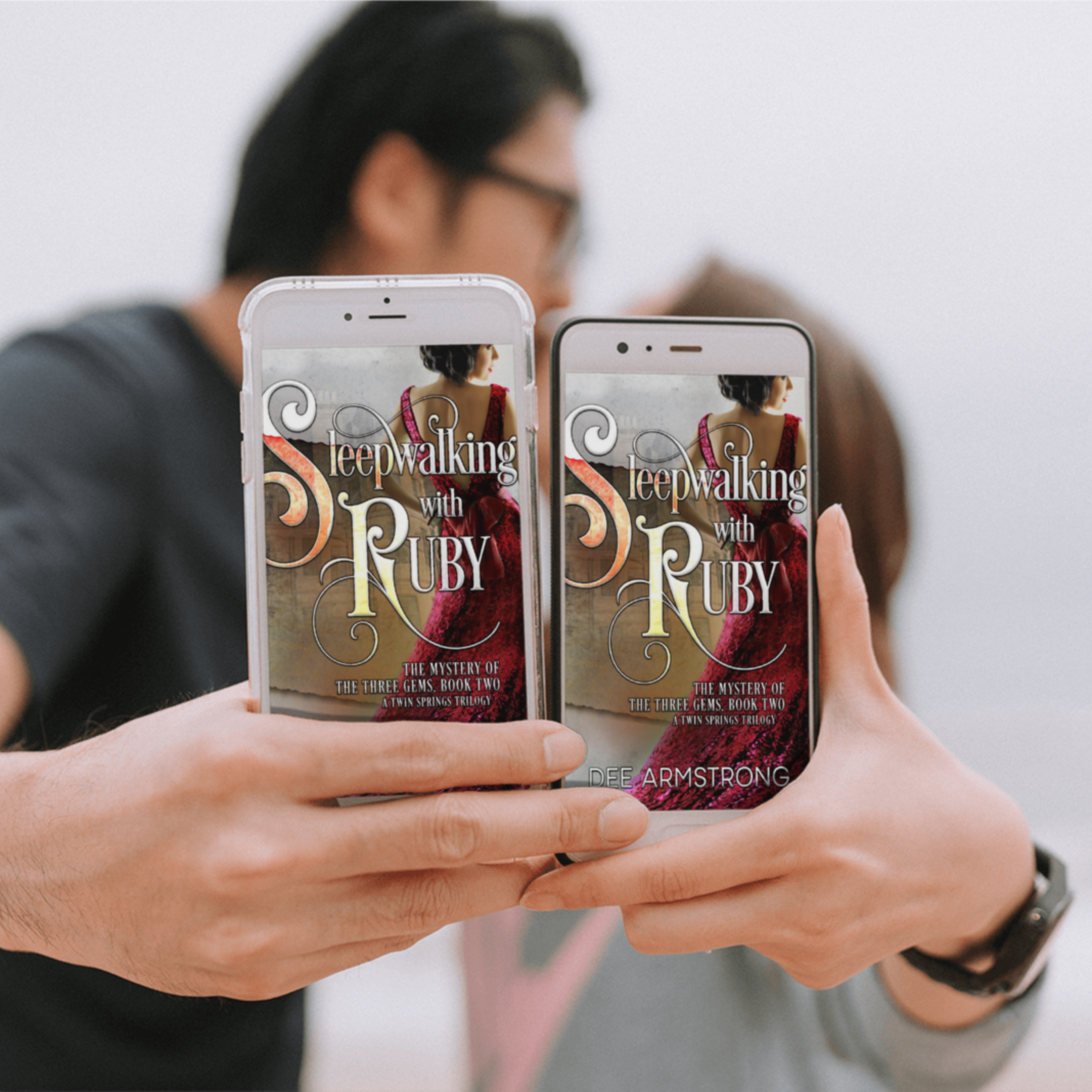 Two people holding smartphones with 'Sleepwalking with Ruby' book covers displayed.