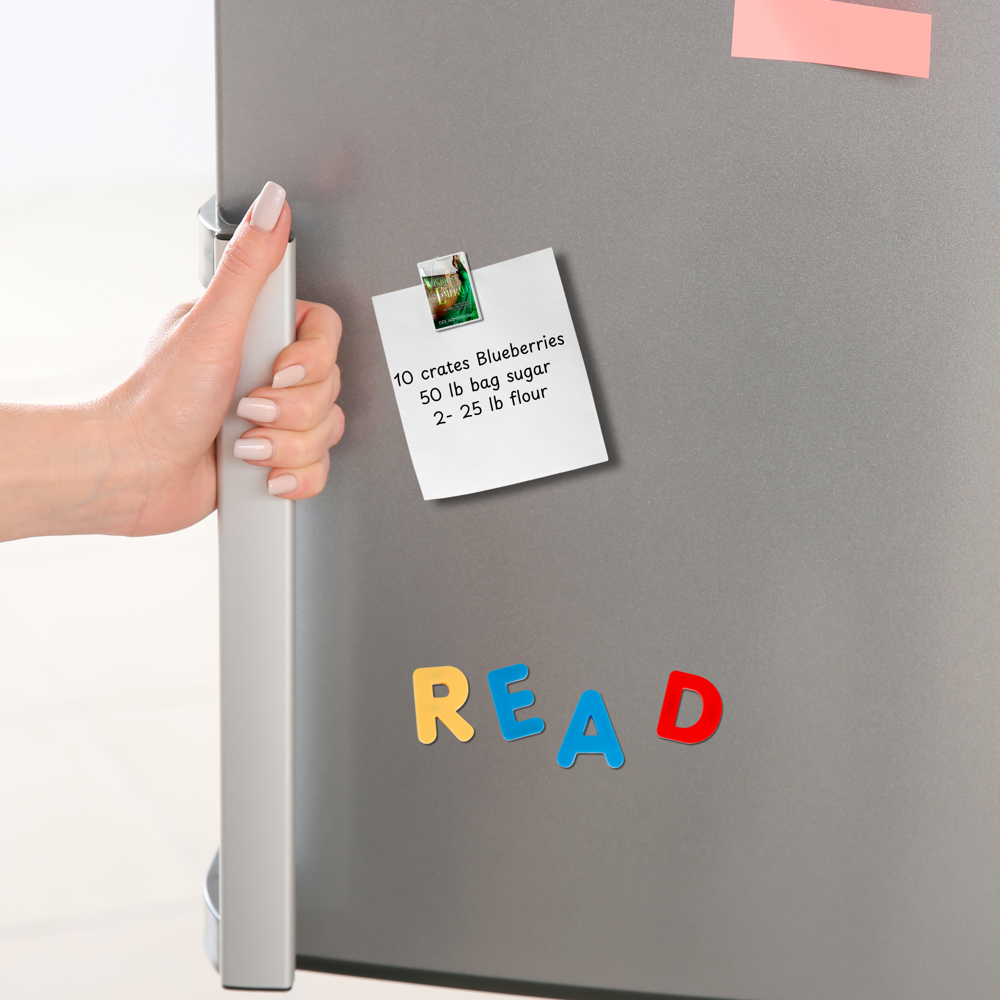 Hand reaching for a door handle with a refrigerator door open, showing a Visions of Emerald magnet holding a note and colorful letters spelling 'READ'.