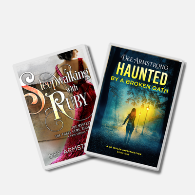 Two acrylic pin book covers titled 'Sleepwalking with Ruby' and 'Haunted by a Broken Oath' on a white background.