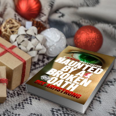 Book titled 'Haunted by a Broken Oath' by Dee Armstrong with Christmas decorations in the background