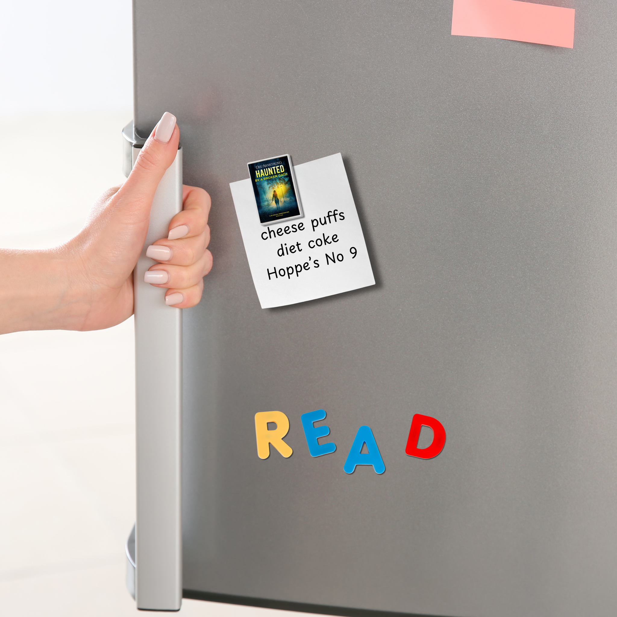 Hand opening a refrigerator door with colorful magnetic letters spelling 'READ' on a gray surface and a list held up by a Haunted by a Broken Oath magnet. 