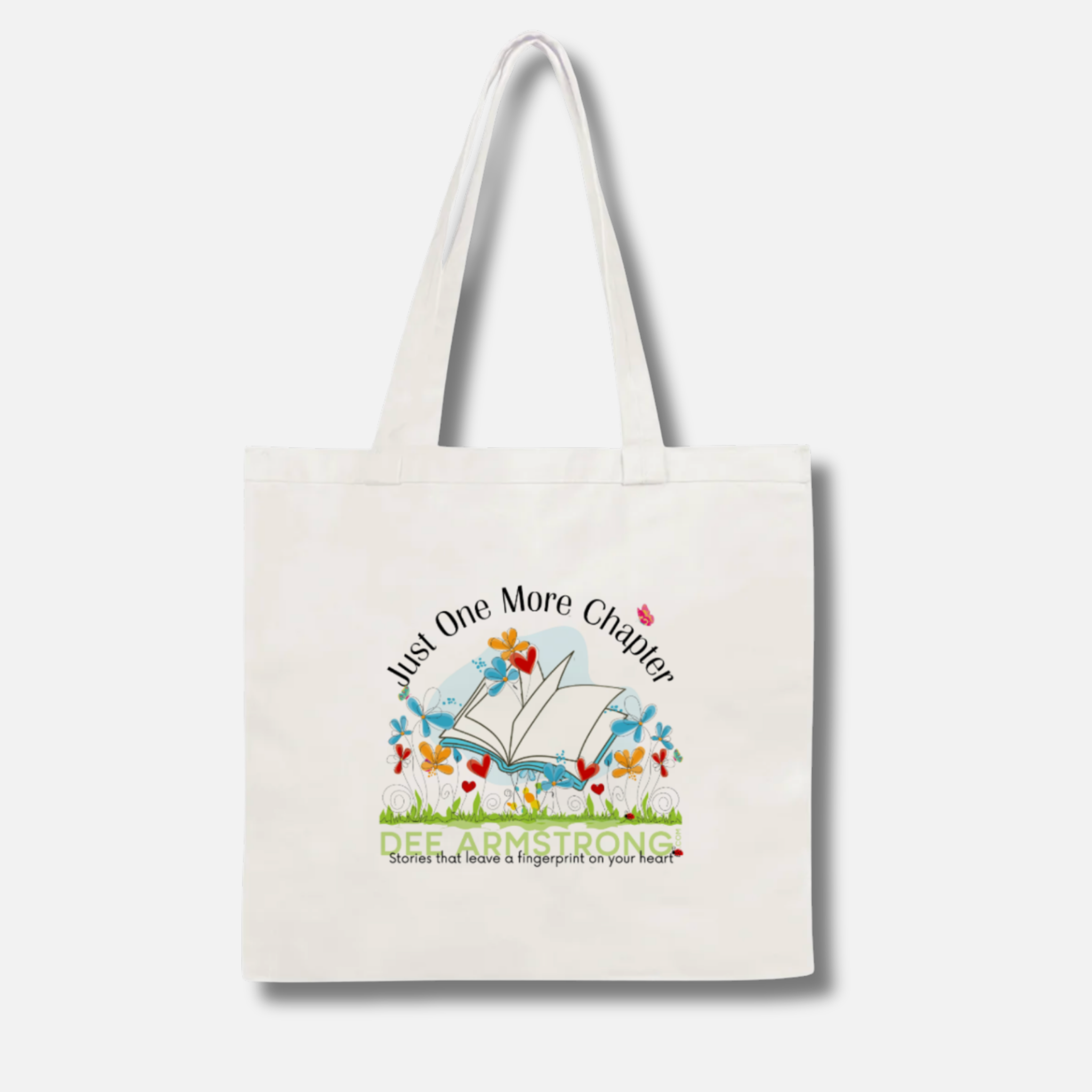 Tote bag with 'Just One More Chapter' design and text on a white background